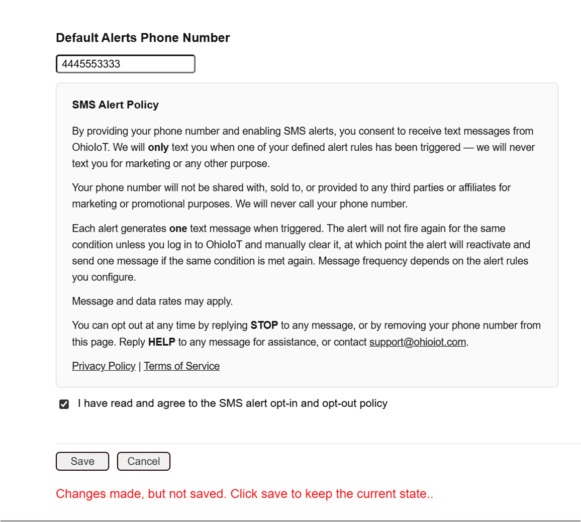 OhioIoT Settings page showing the same Default Alerts Phone Number field and SMS Alert Policy, but with the consent checkbox checked, no warning visible, and the Save button enabled.