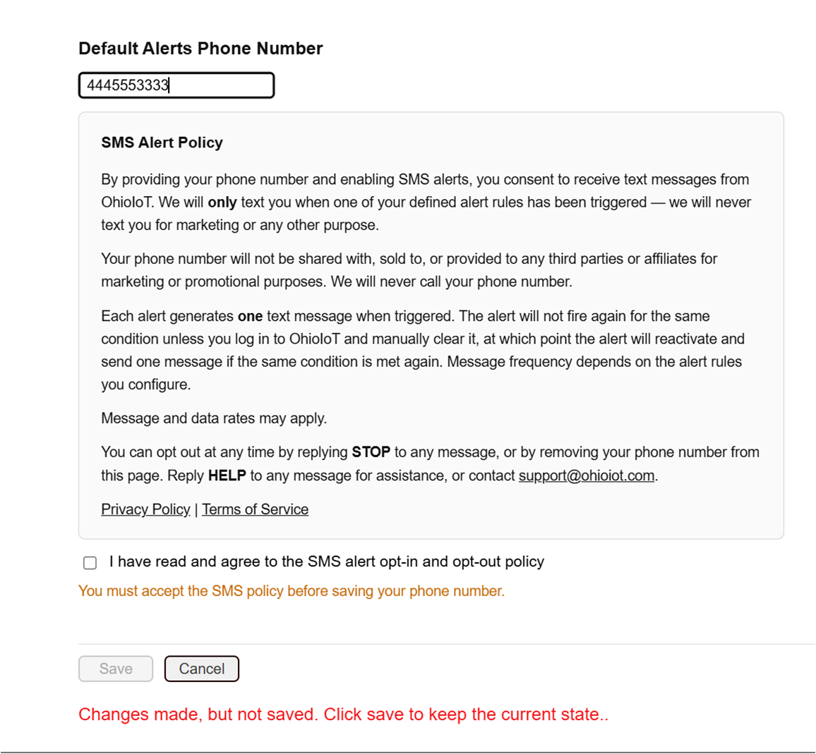 OhioIoT Settings page showing the Default Alerts Phone Number field with a number entered, the full SMS Alert Policy panel displayed below, the consent checkbox unchecked, an orange warning reading 'You must accept the SMS policy before saving your phone number', and the Save button disabled.